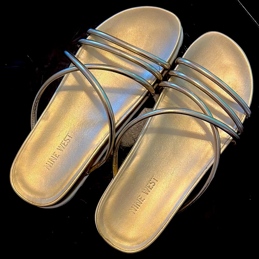 Nine West gold strappy sandals. Size 7.5. Lightly worn. White sole light wear.